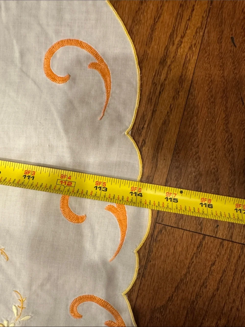White vintage Tablecloth W/ Orange & Yellow Floral  Design. Size 114x64